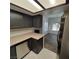 Kitchen featuring neutral countertops, cabinetry, and flooring, with views to the dining room at 1621 Sandecker Ct # 104, Las Vegas, NV 89146