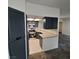Modern kitchen with gray cabinets, stainless steel appliances, and eat-in counter at 1621 Sandecker Ct # 104, Las Vegas, NV 89146