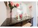 Bathroom vanity with dark granite countertop, large mirror and flamingo decor at 1709 Chapman Dr, Las Vegas, NV 89104