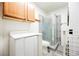 Bathroom with a vanity, commode, shower stall, and stacked washer and dryer at 1709 Chapman Dr, Las Vegas, NV 89104