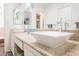 Bright bathroom featuring dual sinks, granite countertops, and modern faucets at 1709 Chapman Dr, Las Vegas, NV 89104