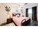 Bedroom with hardwood floors, a queen-sized bed, and decorative accents for a comfortable space at 1709 Chapman Dr, Las Vegas, NV 89104
