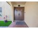 Welcoming front entrance to the home with double doors and decorative plants at 1709 Chapman Dr, Las Vegas, NV 89104
