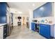 Open kitchen with blue cabinets, stainless steel appliances, and easy access to living area at 1709 Chapman Dr, Las Vegas, NV 89104