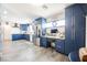 Bright kitchen with blue cabinets, stainless steel appliances, and a built-in desk area at 1709 Chapman Dr, Las Vegas, NV 89104