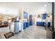 Open concept kitchen with blue cabinets, modern appliances, and easy access to living area at 1709 Chapman Dr, Las Vegas, NV 89104