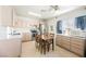 A cozy kitchen with stainless steel appliances, light wood cabinets and a ceiling fan offers a clean and inviting space at 1709 Chapman Dr, Las Vegas, NV 89104