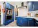 Updated kitchen with blue cabinets, stainless steel oven, and modern backsplash at 1709 Chapman Dr, Las Vegas, NV 89104