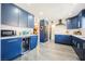 Stylish kitchen with blue cabinetry, built-in appliances, and ample counter space at 1709 Chapman Dr, Las Vegas, NV 89104