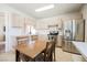 Bright eat-in kitchen with stainless steel appliances, and natural light offers an inviting space for cooking and gathering at 1709 Chapman Dr, Las Vegas, NV 89104