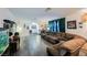 Spacious living room with a comfortable sectional couch, unique decorations, and wood-look flooring at 1709 Chapman Dr, Las Vegas, NV 89104