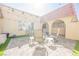 View of a large brick-paved patio with seating, decorative lights and an inviting ambiance at 1709 Chapman Dr, Las Vegas, NV 89104