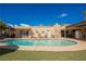 Beautiful swimming pool with diving board, ample seating, lush landscaping and sparkling blue water at 1709 Chapman Dr, Las Vegas, NV 89104