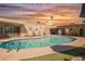 Sparkling pool with diving board, lounge chairs, and lush landscaping offers a private backyard oasis at 1709 Chapman Dr, Las Vegas, NV 89104