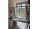 Bathroom featuring a shower-tub combo and vanity with a marble countertop at 1801 Calle De Vega, Las Vegas, NV 89102