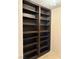 Built-in dark stained bookcase with shelving at 1801 Calle De Vega, Las Vegas, NV 89102