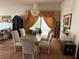Formal dining room with a chandelier, marble table and six chairs, and decor at 1801 Calle De Vega, Las Vegas, NV 89102
