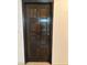 Dark stained, paneled interior door at 1801 Calle De Vega, Las Vegas, NV 89102