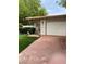 Charming home exterior with brick driveway, manicured lawn, and gated entrance at 1801 Calle De Vega, Las Vegas, NV 89102