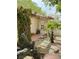 Front yard entry with stone landscaping and tiled walkway with bushes, trees and plants at 1801 Calle De Vega, Las Vegas, NV 89102