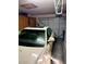 Well lit garage featuring white car with sunroof, garage door and visible garage door mechanism on ceiling at 1801 Calle De Vega, Las Vegas, NV 89102