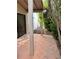 Tiled patio area with view of walkway, plants and trees at 1801 Calle De Vega, Las Vegas, NV 89102