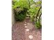Walkway with rocks and stone pavers with trees and bushes at 1801 Calle De Vega, Las Vegas, NV 89102