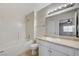 Bathroom featuring a bathtub, shower, and vanity with a large mirror and overhead lighting at 1881 W Alexander Rd # 1135, North Las Vegas, NV 89032