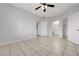 Spacious bedroom with tiled floors, ceiling fan, closet, and bathroom access at 1881 W Alexander Rd # 1135, North Las Vegas, NV 89032