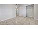 Bedroom featuring neutral walls, tile flooring, and a sliding door closet for storage at 1881 W Alexander Rd # 1135, North Las Vegas, NV 89032