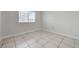 Bright bedroom with neutral walls, tile flooring, and a window with natural light at 1881 W Alexander Rd # 1135, North Las Vegas, NV 89032