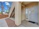Exterior entrance featuring security gate, address number and welcoming door decor at 1881 W Alexander Rd # 1135, North Las Vegas, NV 89032