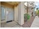 Exterior entrance featuring security gate, address number and welcoming door decor at 1881 W Alexander Rd # 1135, North Las Vegas, NV 89032