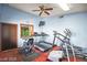 Exercise room featuring treadmills, stationary bikes, ceiling fan and carpeted flooring at 1881 W Alexander Rd # 1135, North Las Vegas, NV 89032