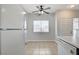 Charming kitchen nook with tiled floor, ceiling fan, and natural light from window at 1881 W Alexander Rd # 1135, North Las Vegas, NV 89032