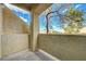 Outdoor patio featuring neutral stucco with a view of trees and the surrounding neighborhood at 1881 W Alexander Rd # 1135, North Las Vegas, NV 89032
