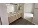 Bathroom with double sinks and a vanity, next to the primary bedroom at 2282 Camel Mesa Dr, Laughlin, NV 89029