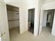 Bedroom with a walk-in closet and ensuite bathroom with a gray-toned floor at 2282 Camel Mesa Dr, Laughlin, NV 89029