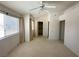 Spacious bedroom includes a ceiling fan, a walk-in closet, and ensuite bathroom at 2282 Camel Mesa Dr, Laughlin, NV 89029