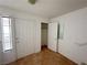 Hallway with tile flooring and access to a closet, entry door, and window at 2282 Camel Mesa Dr, Laughlin, NV 89029