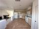 Spacious kitchen connects to the living room, featuring tile floors and standard appliances at 2282 Camel Mesa Dr, Laughlin, NV 89029