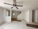 View of the living room stairs and ceiling fan at 2282 Camel Mesa Dr, Laughlin, NV 89029
