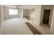 Bright living room leading to the stairway and featuring a ceiling fan at 2282 Camel Mesa Dr, Laughlin, NV 89029