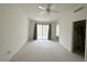 Spacious main bedroom with a ceiling fan and large sliding doors at 2282 Camel Mesa Dr, Laughlin, NV 89029