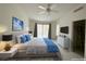 Comfortable bedroom with sliding glass door, ceiling fan, and ensuite bathroom access at 2282 Camel Mesa Dr, Laughlin, NV 89029