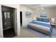 Comfortable bedroom with bathroom access, featuring a ceiling fan and serene decor at 2282 Camel Mesa Dr, Laughlin, NV 89029