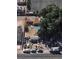An aerial view of a residential neighborhood, featuring tree coverage and multiple parked cars at 2520 Sunrise St, Las Vegas, NV 89101