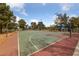 A well-maintained basketball court surrounded by mature trees at 274 Pear Meadow St, Henderson, NV 89012