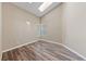 Bedroom with wood-look flooring, bright natural light, and neutral wall color at 274 Pear Meadow St, Henderson, NV 89012