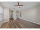 Comfortable bedroom with wood floors and access to an ensuite bathroom at 274 Pear Meadow St, Henderson, NV 89012